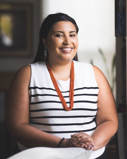 Image of Danielle near a chair and window
